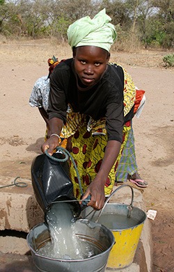 buildon-woman-getting-water-for-the-work-site