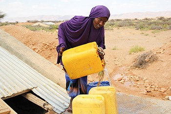 Woman pouring water.