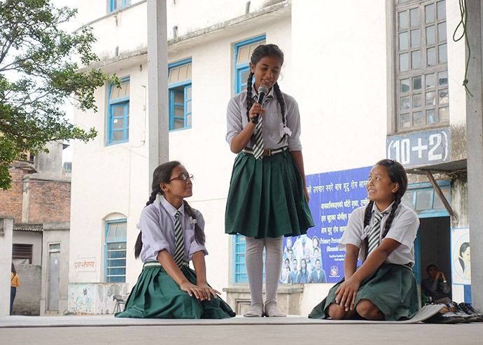 Female student leaders give speeches to their classmates about hygiene education at Adarsha Kanya School in Lalitpur District, Nepal, on Menstrual Hygiene Day, May 28, 2017. (Credit: Splash)