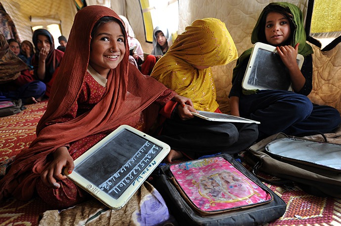 Girls study math in an IRC-run school in Pakistan's Jalozai camp, home to almost 10,000 people displaced by fighting between the Pakistani army and the Taliban