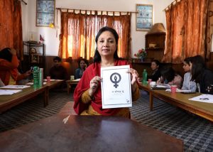 Woman holding up the People's Call to Nations