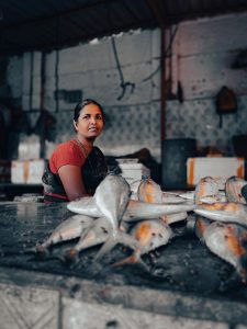 Woman worker with fish