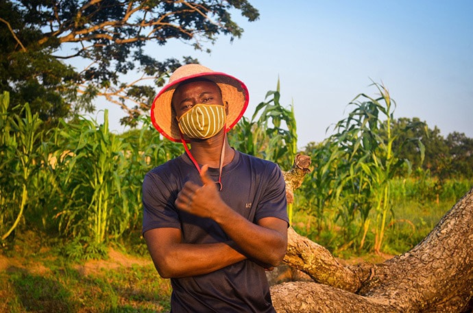 Nigerian farmer posing in field