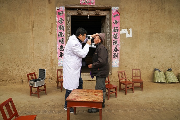 Ophthalmologist Examines Patient