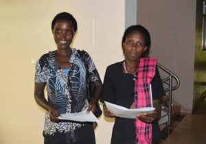 Two women posing with awards