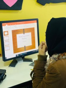 Student prepares a PowerPoint