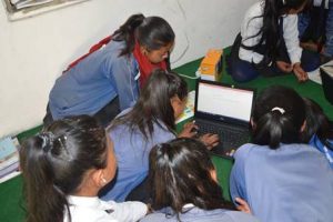 Young girls using laptop