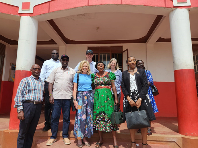 Board members pose for photo on visit to a school in Africa