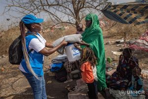 Aid worker with refugee
