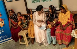 Meera speaking with young mothers