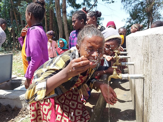 View of students drinking water