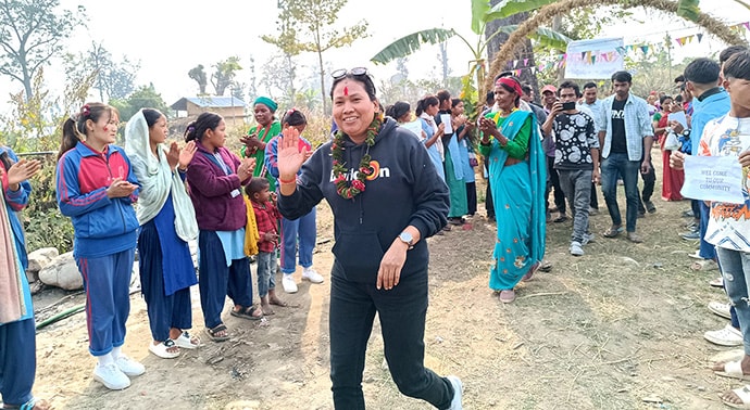 Photo of group entering village