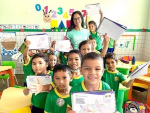 Students in classroom posing for photo