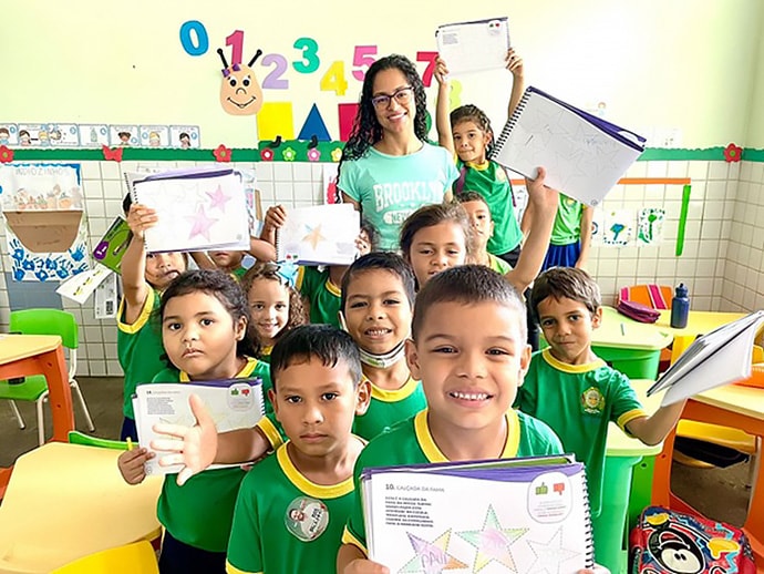 Students in classroom posing for photo