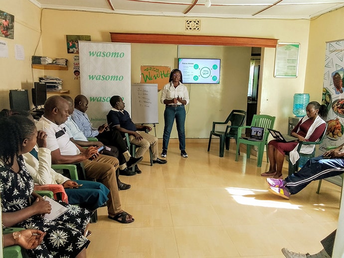 Sharon Adhiambo speaking to group