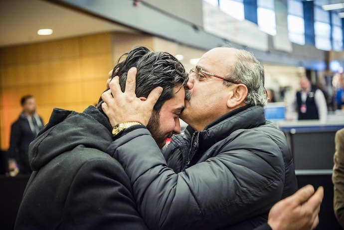 Photo of Ahmed and Walid embracing