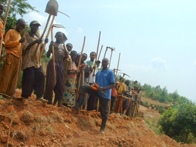 Photo of men holding tools