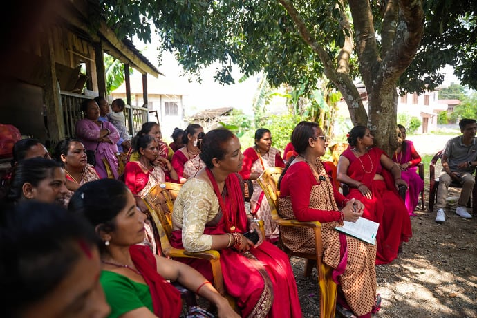 Photo of members in meeting outdoors