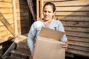 Photo of woman holding box