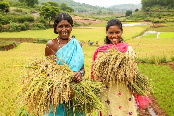 Woman and Daughter posing in field