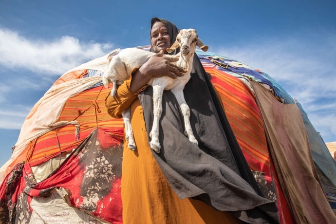 Photo of Dhagan Aclan Aalan holding a goat