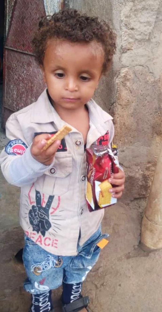 Photo of child holding crackers