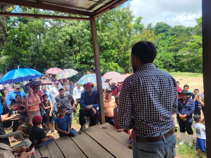 Photo of speaker in front of crowd