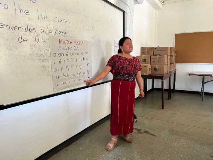 Teacher at board in classroom