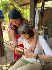 Photo of woman learning to weave