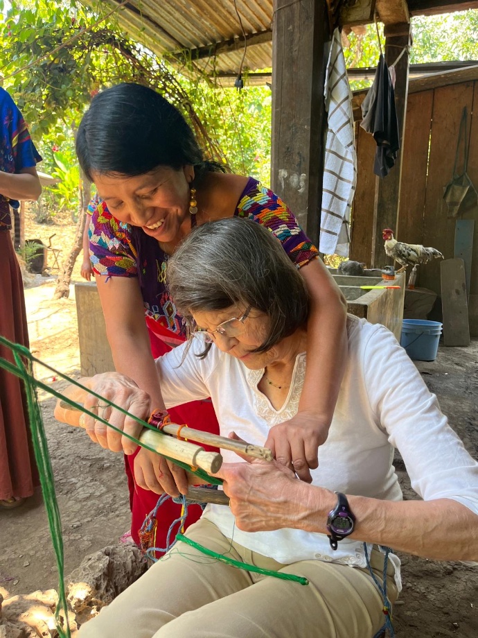 Photo of woman learning to weave