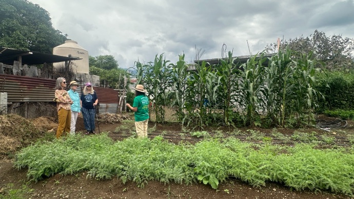 Group photo with farmer in field