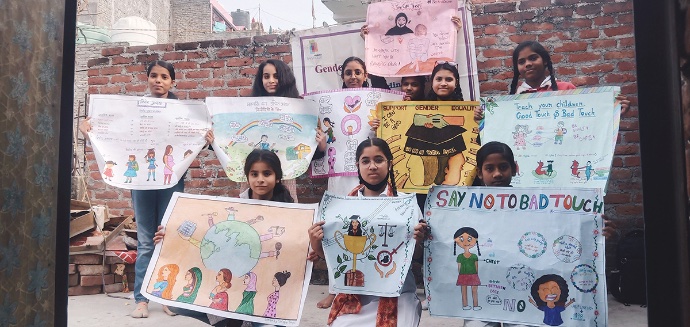 View of girls holding posters