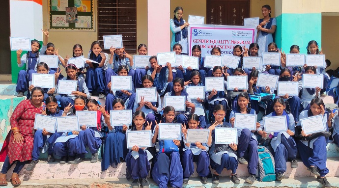 Group photo of girls holding certificates