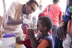 Photo of child receiving medicine