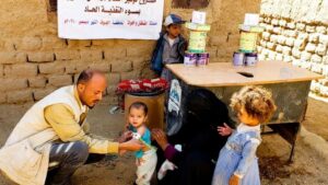 Photo of child being tested for malnutrition