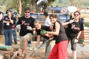 Young adult volunteer with village women in Thailand